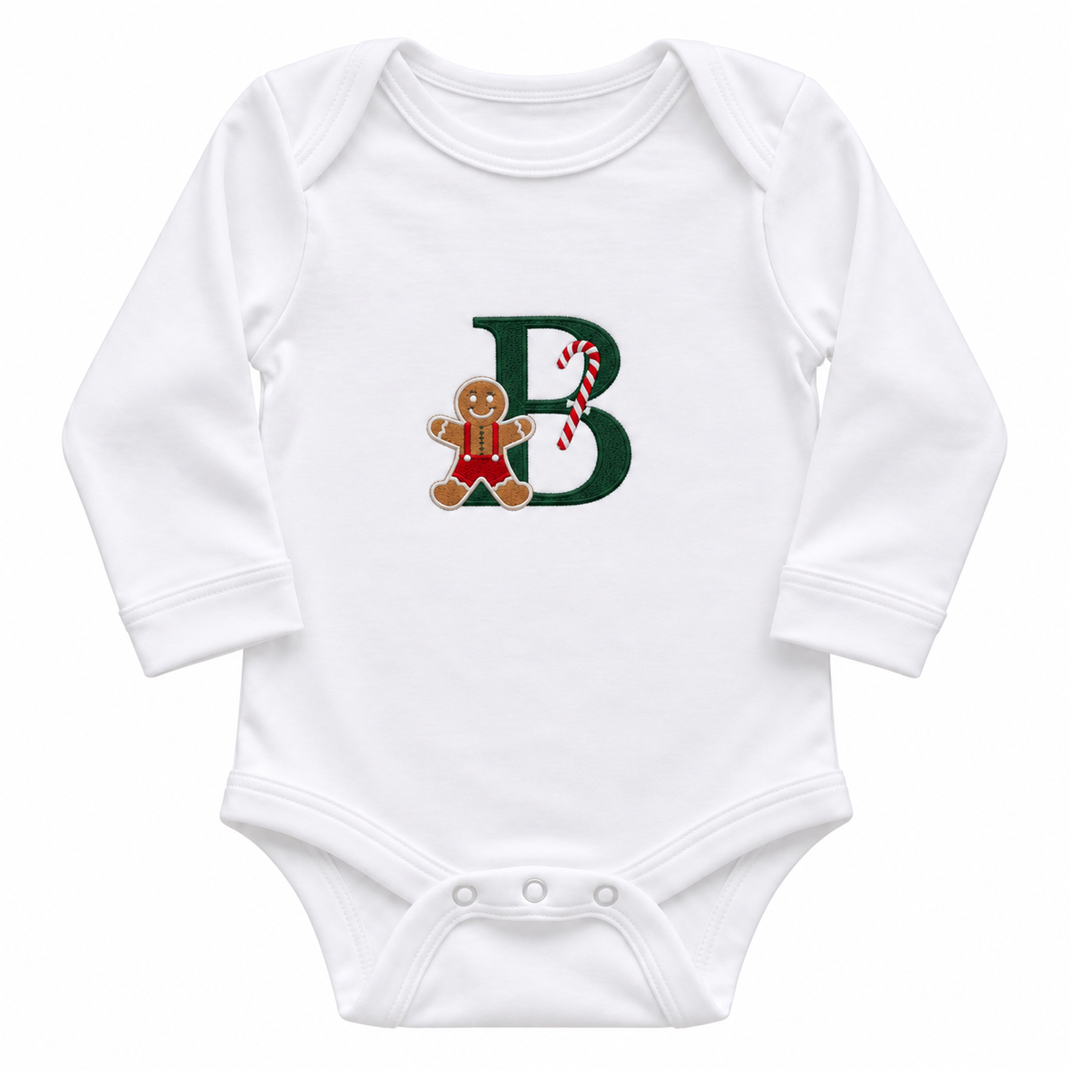 Close-up of personalised gingerbread Christmas initial embroidery with forest green letter, red overalls and candy cane
