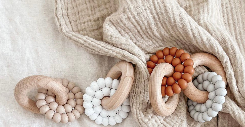 Beaded teether with wooden ring