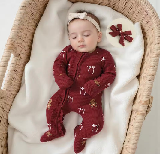 Festive holiday baby outfit with matching bow and candy cane design 