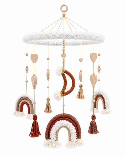     Neutral boho baby crib mobile with rainbow details, moon accent, tassels, and wooden beads hanging above a baby cot.