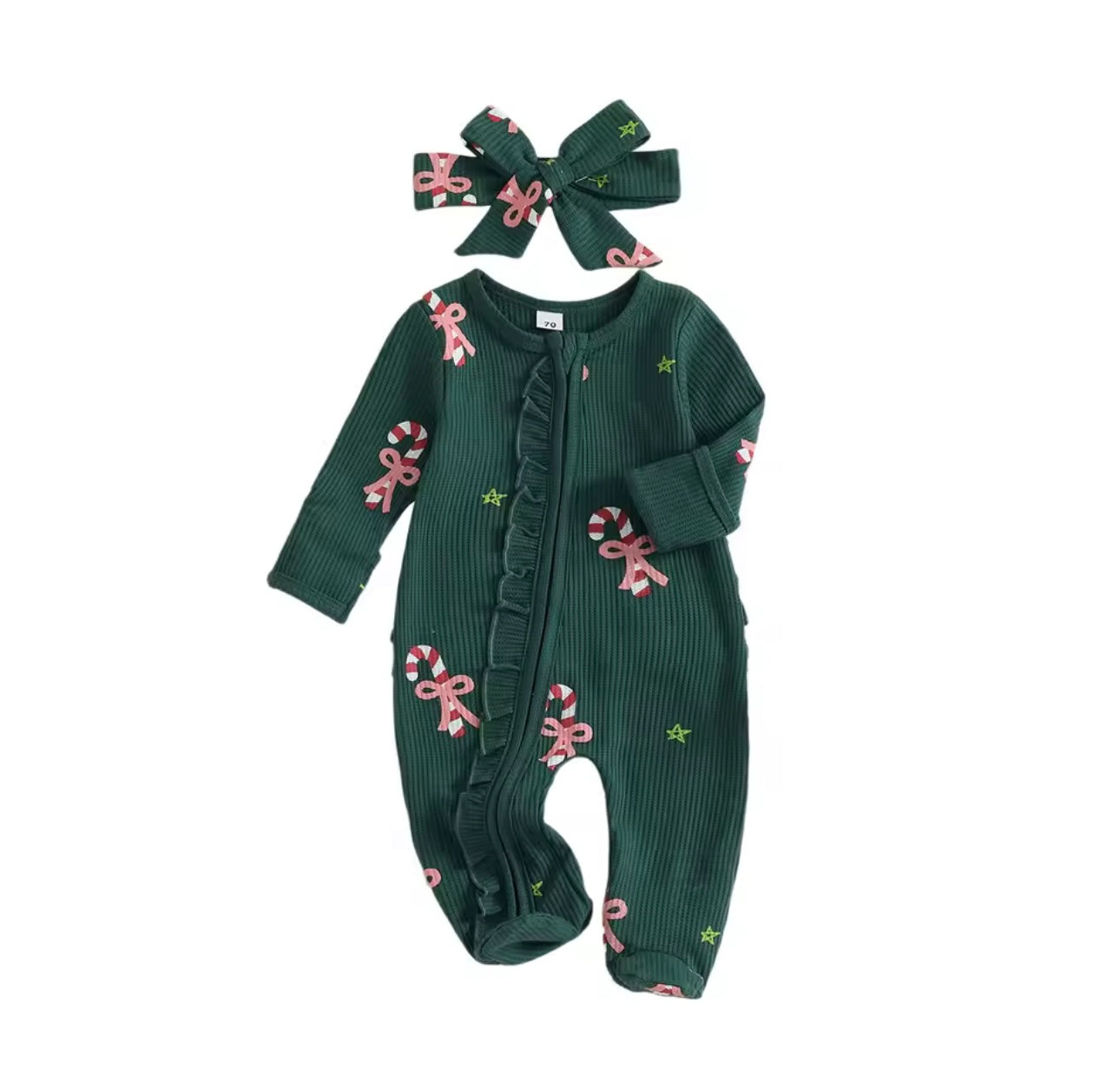 Festive holiday baby outfit with matching bow and candy cane design on deep green fabric.