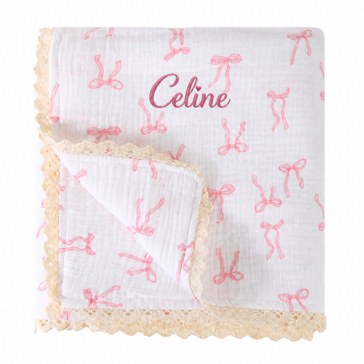 Personalised pink bow cotton muslin baby blanket with lace trim and Celine name embroidery