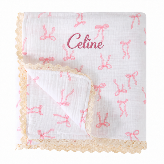 Personalised pink bow cotton muslin baby blanket with lace trim and Celine name embroidery