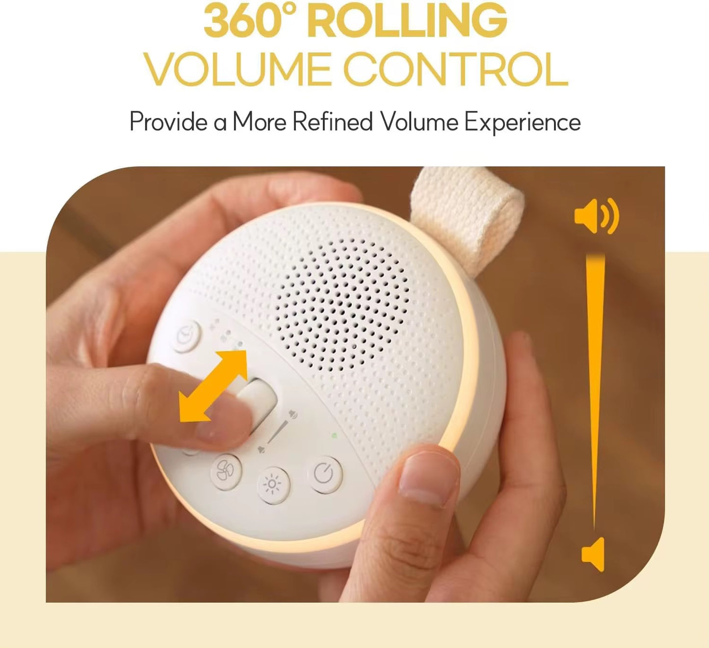 Hands adjusting the 360-degree rolling volume control on a portable baby white noise machine with warm LED night light.
