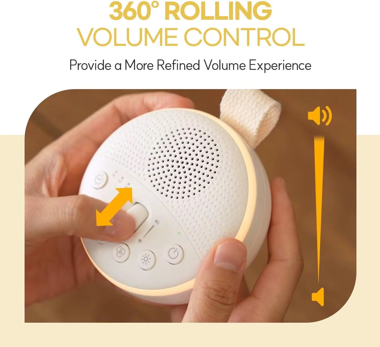 Hands adjusting the 360-degree rolling volume control on a portable baby white noise machine with warm LED night light.
