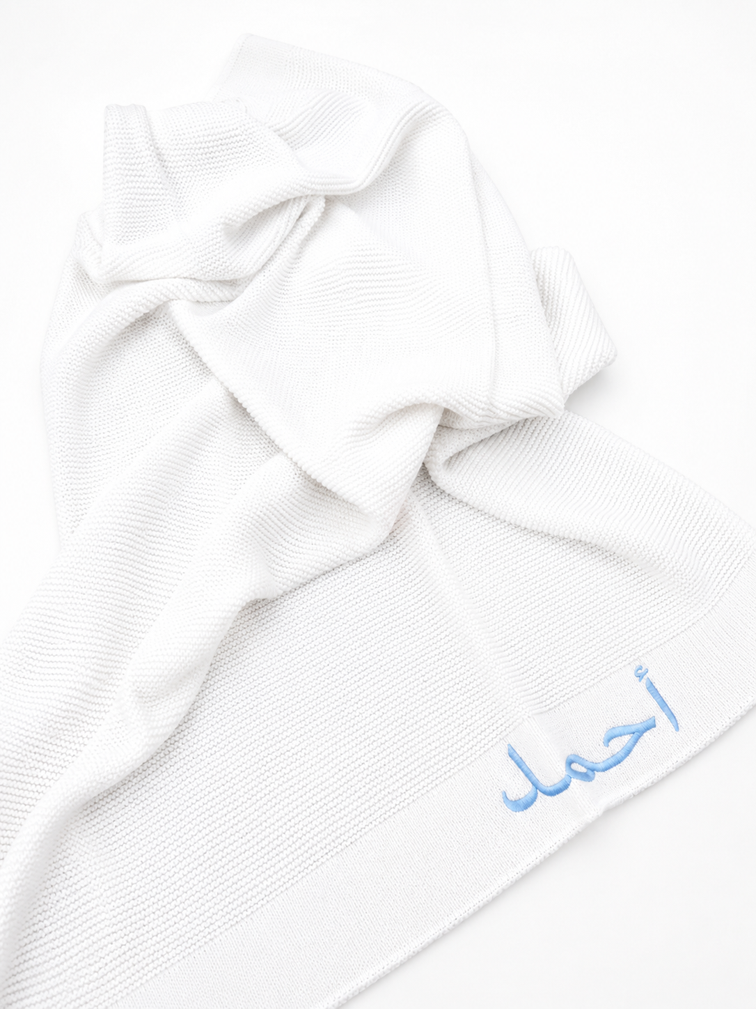 Premium bamboo cotton baby blanket showing soft cellular knit texture — breathable and hypoallergenic for newborn skin
