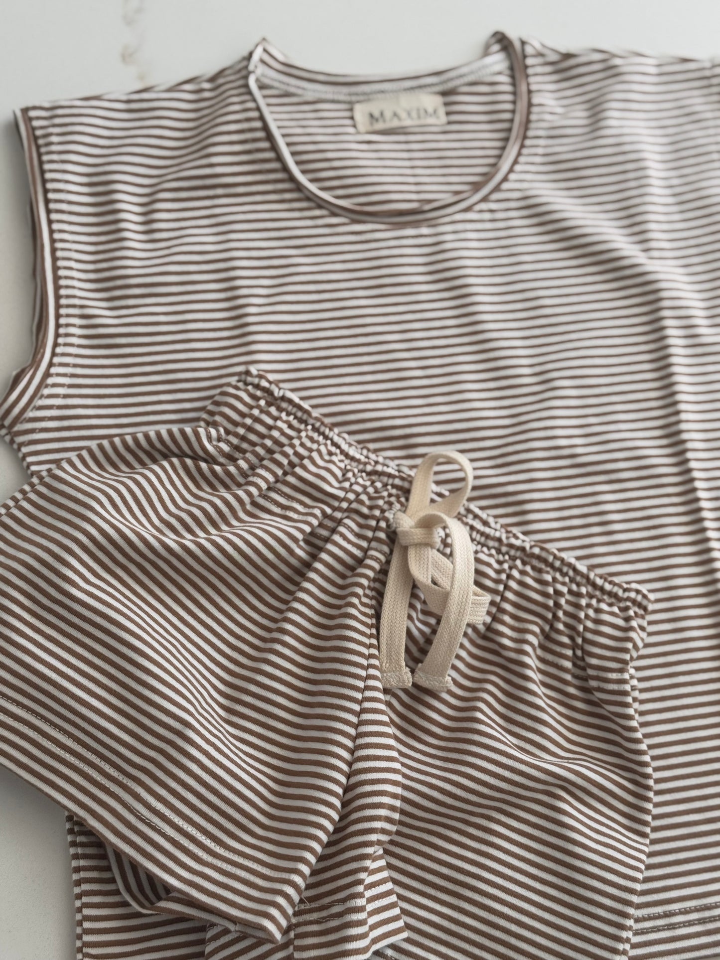 Lightweight cotton striped short set for boys and girls in a neutral colour palette.