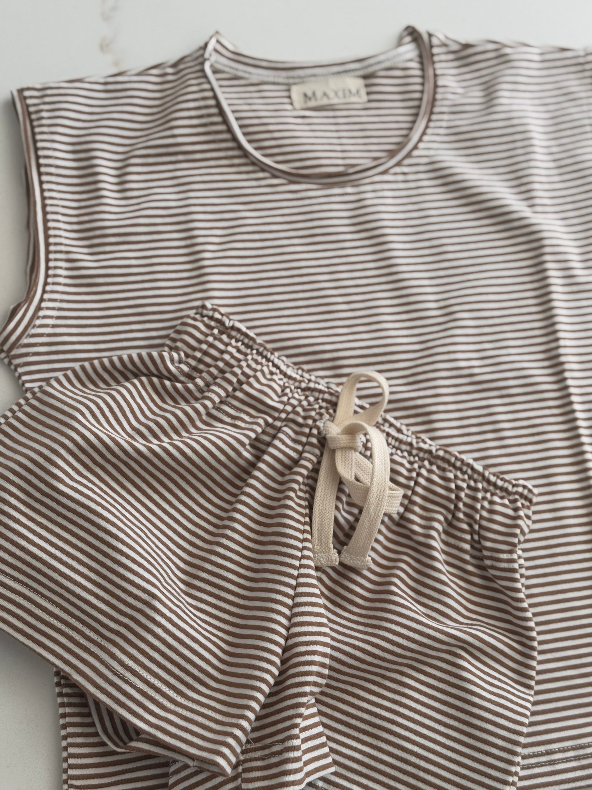 Lightweight cotton striped short set for boys and girls in a neutral colour palette.