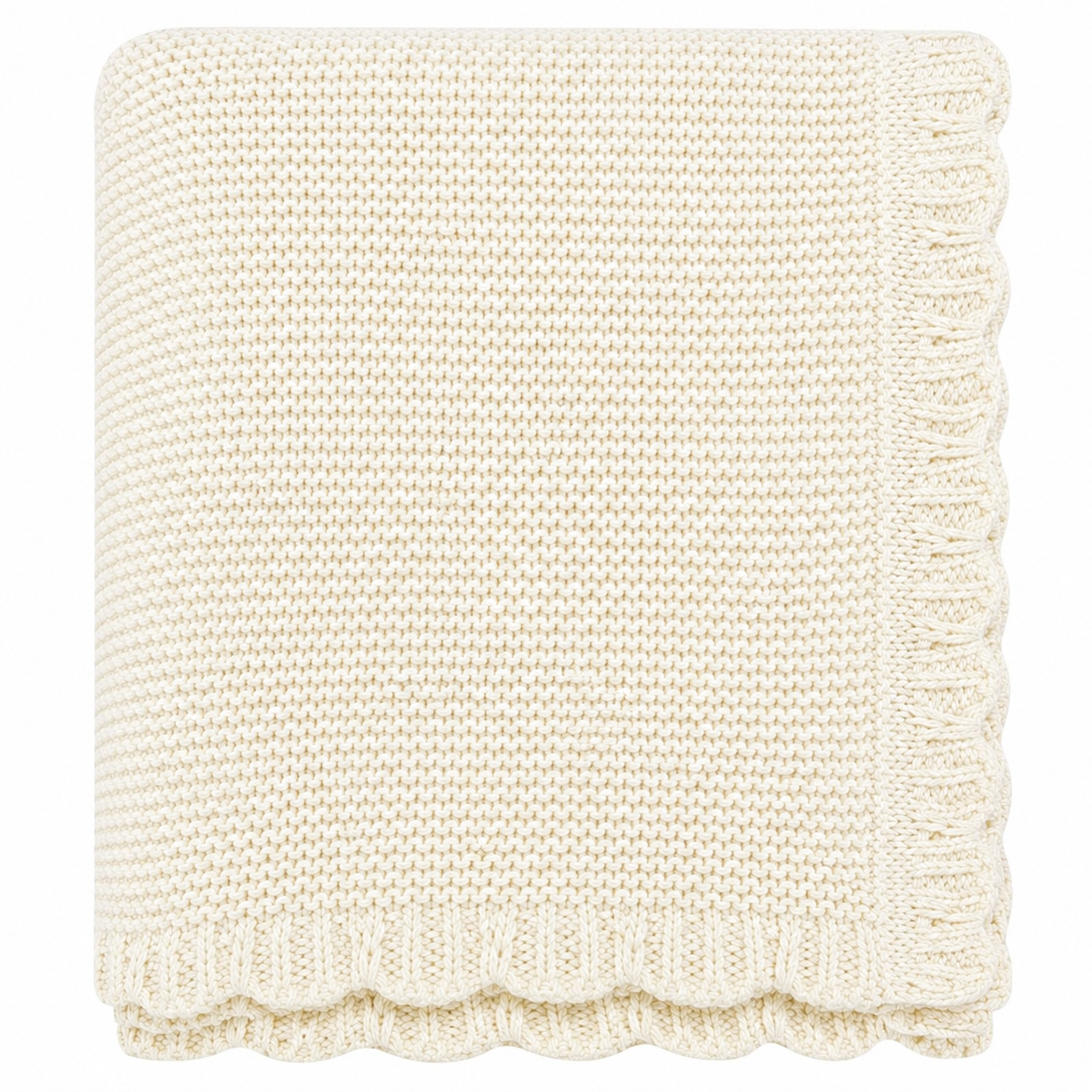 Cream scalloped knitted baby blanket folded neatly on a white background.