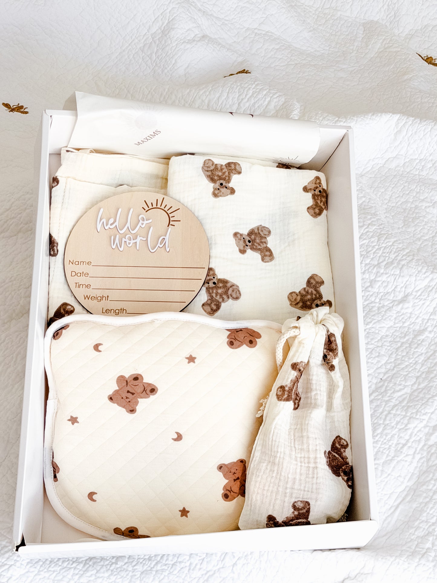 Maxims baby store. Hello Little Cub newborn gift box with teddy bear muslin blanket, anti-flat-head pillow, hello world milestone disc, brush set and bedside organiser — unisex baby gift in Dubai UAE
