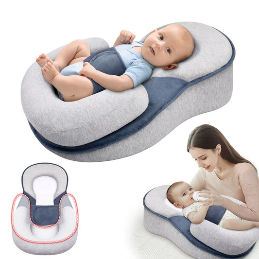Baby lying comfortably in a Maxims anti-reflux baby lounger pillow with ergonomic newborn support and feeding cushion design.