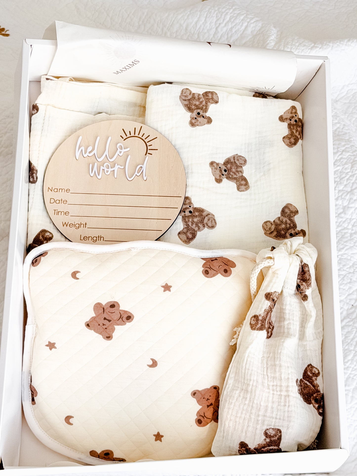 Signature Maxims Baby Store unisex newborn gift hamper with teddy bear print muslin and quilted nursery essentials — perfect baby shower, Aqiqah and welcome home gift in the UAE
