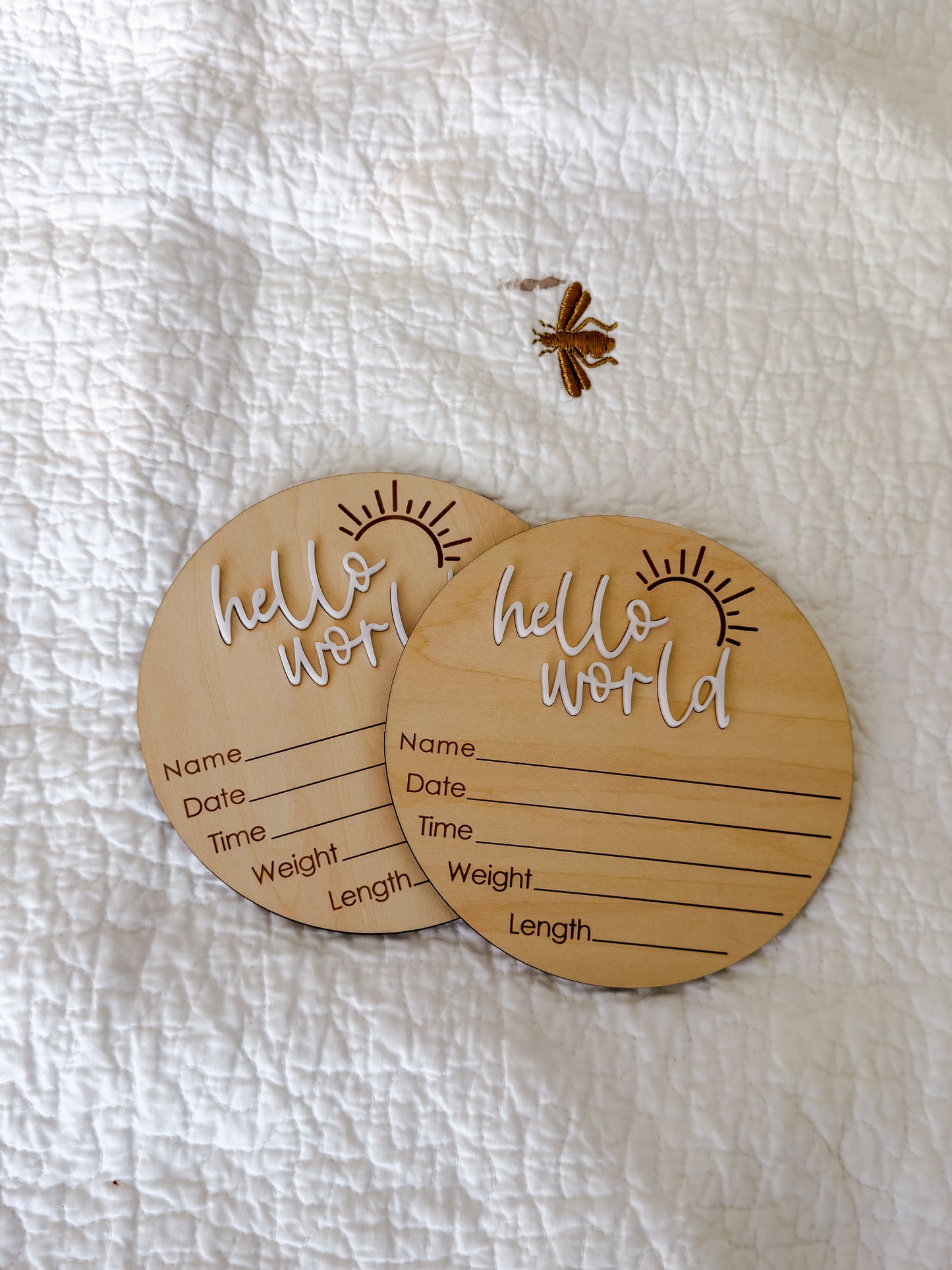 Hello World milestone disc styled as newborn birth announcement keepsake — beautiful baby photo prop for Dubai families
