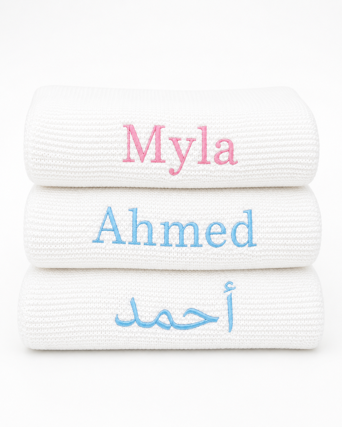 Close-up of English name embroidery on soft white bamboo cotton baby blanket — Maxims Gift Co. personalised newborn gift
