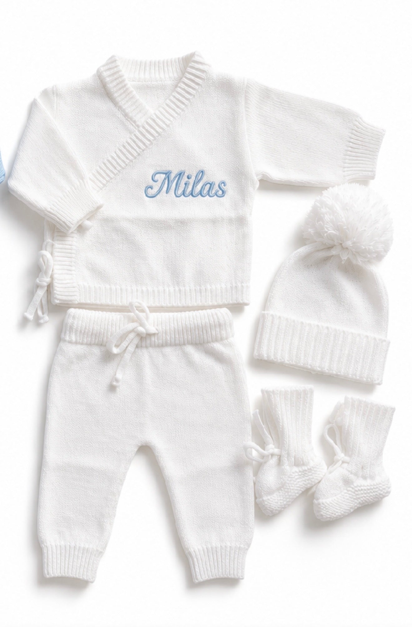 Detail view of personalised white bamboo cotton newborn knit outfit set with embroidered name — Maxims Baby store .UAE
