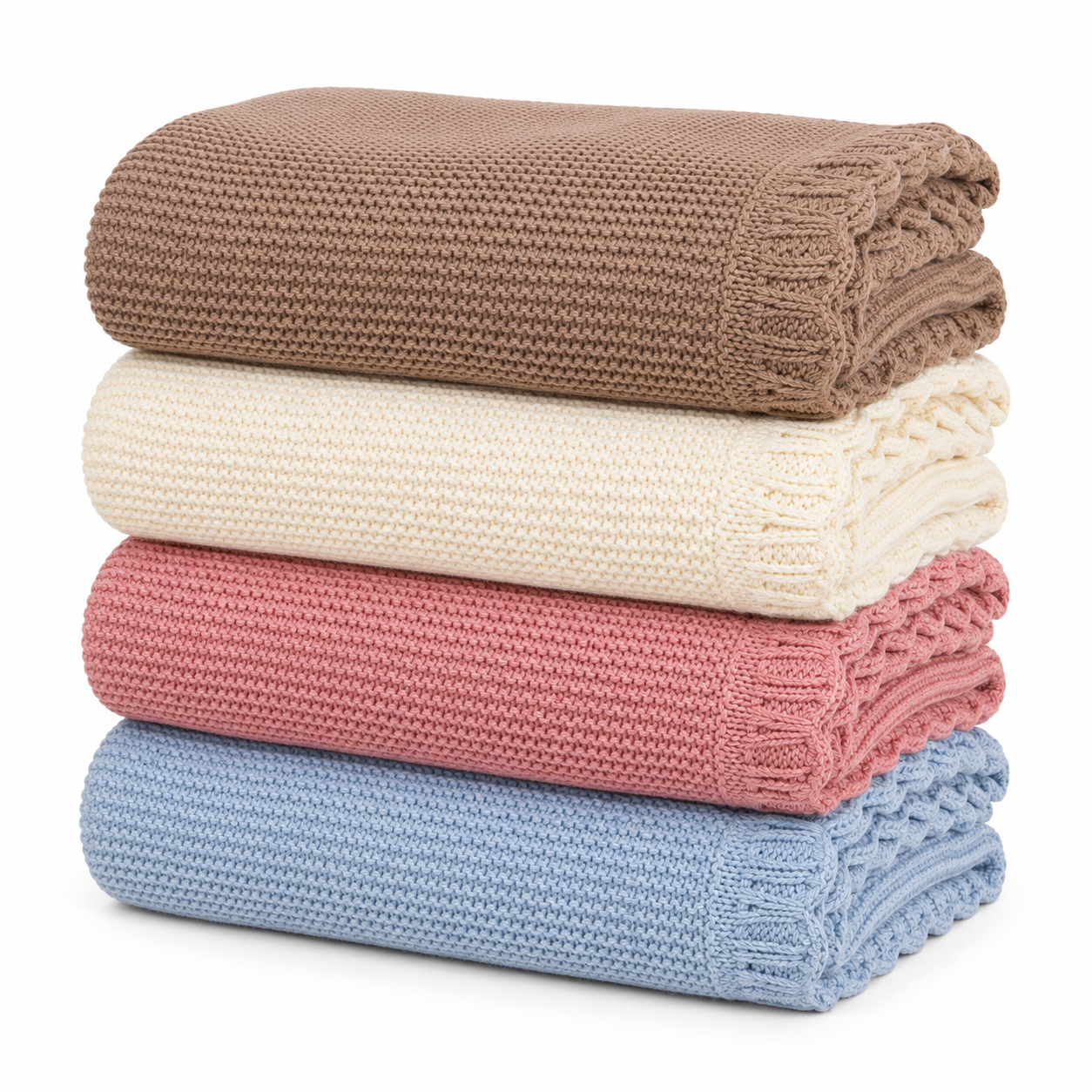 Stacked scalloped knitted baby blankets in brown, cream, blush pink and baby blue on a white 