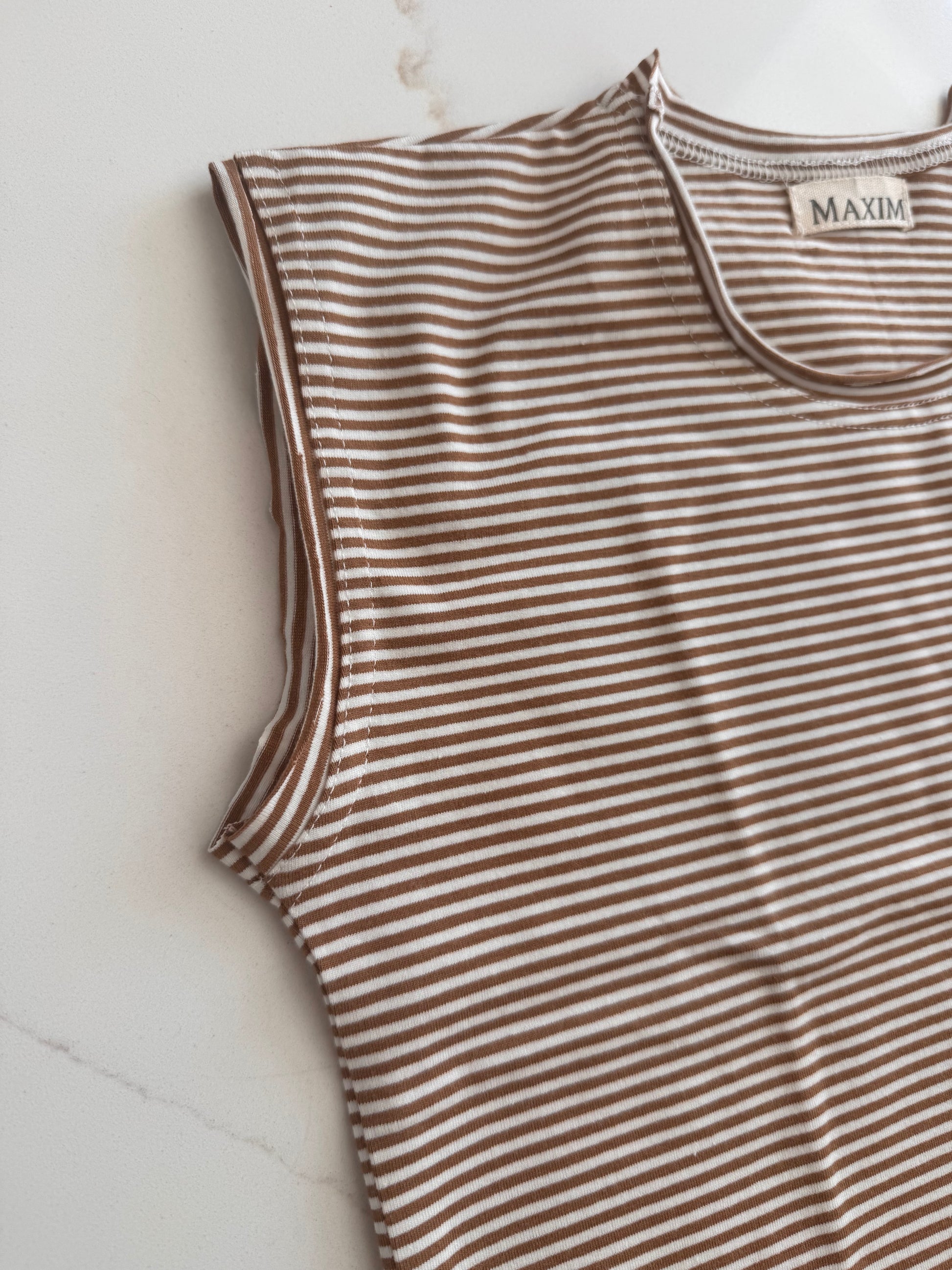 Unisex neutral stripe cotton outfit with matching shorts for summer wear.