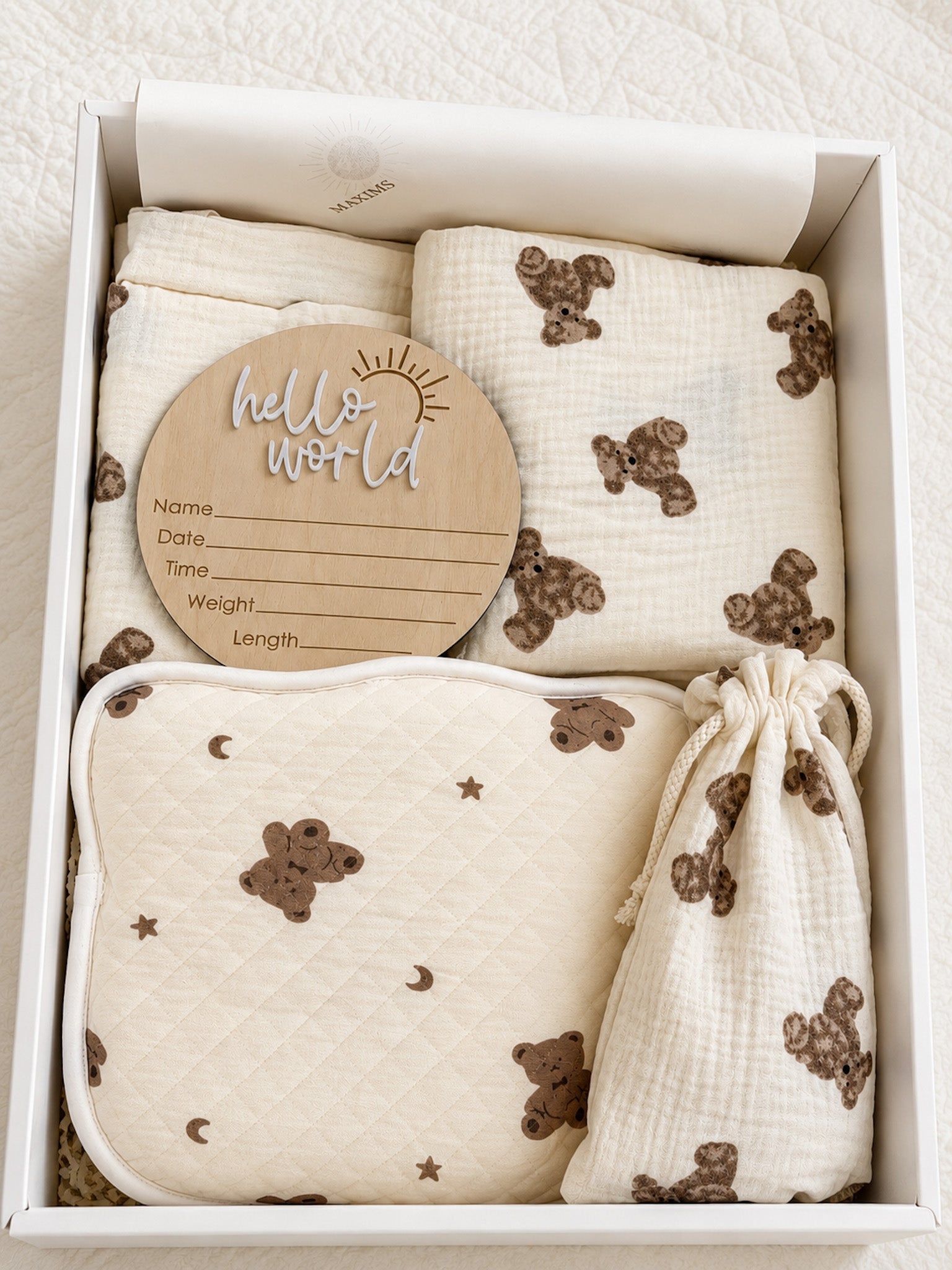 Unisex newborn baby gift box with teddy bear muslin blanket, quilted moon and stars blanket, hello world milestone disc, and matching drawstring pouch — Maxims baby store . UAE
